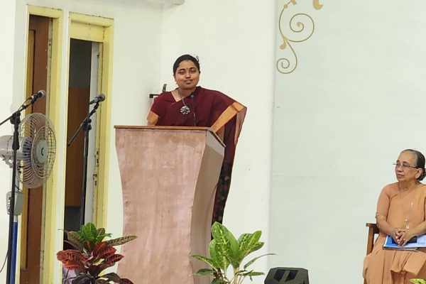 Vidya Speaking at the Podium